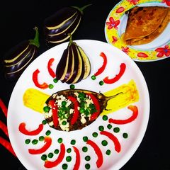 Cheesy Stuff Soyabean Boat Brinjal Bharta A picture of Cheesy Stuff Soyabean Boat Brinjal Bharta.