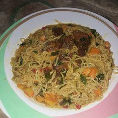 A picture of Indomie noodles with veggies and maringa(zogala).