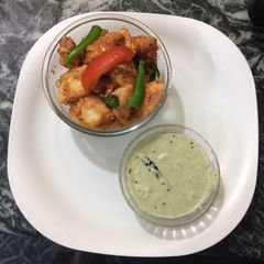 A picture of Tomato chilli idli with coconut chutney.