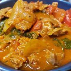 A picture of Red Thai Curry with Pork.