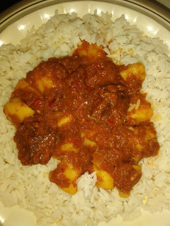 A picture of White rice and potato stew.