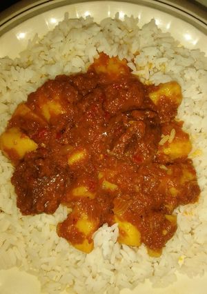 A picture of White rice and potato stew.