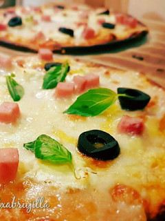 Una foto de Pizza con aceite de oliva
