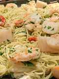 Poached shrimp and scallop pasta in beurre blanc