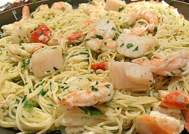 Poached shrimp and scallop pasta in beurre blanc