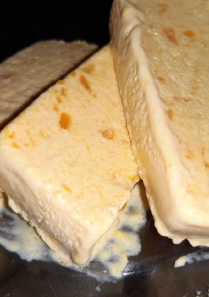 A picture of Creamy mango cheese cake slices.