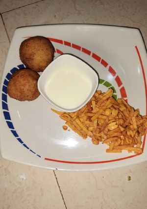 A picture of Farali pattice with curd and chivdo.