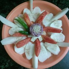 A picture of Onion,tomato,turnip salad.