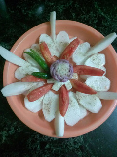 A picture of Onion,tomato,turnip salad.