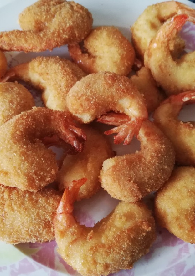 Una foto de Langostinos con bechamel 🍤🦐🍤