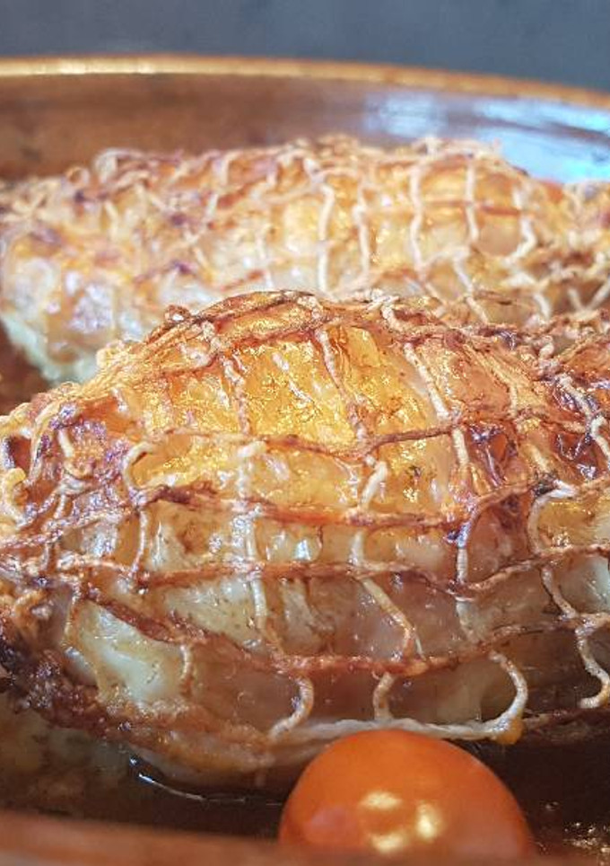 Una foto de Pollo relleno de jamón, bacon y queso