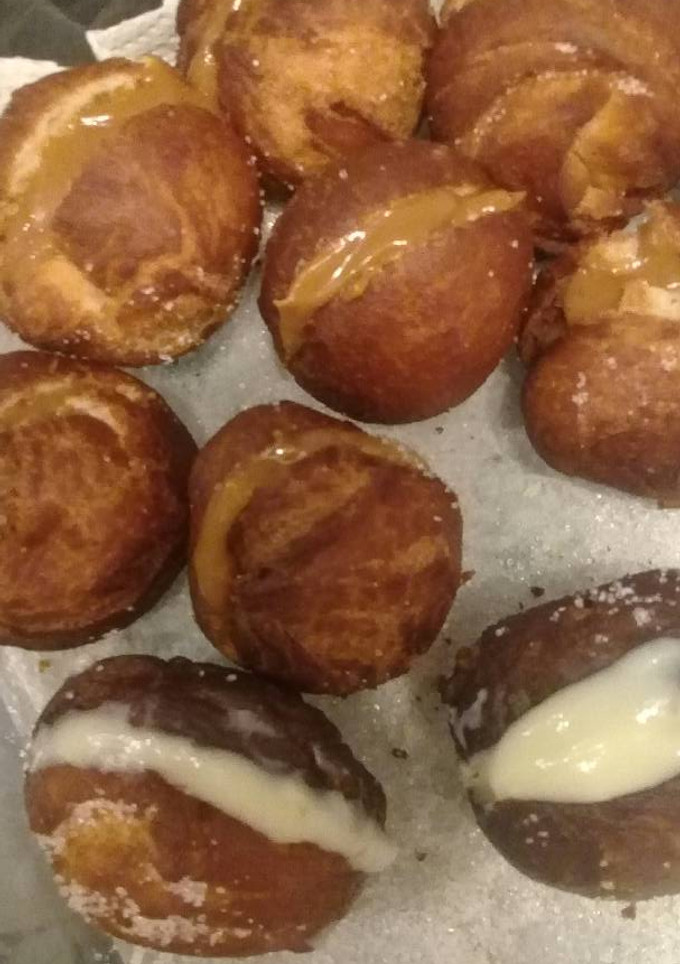 Una foto de Bolitas de fraile rellenas de dulce de leche y crema pastelera