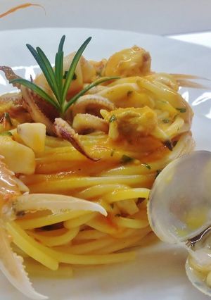 A picture of Spaghetti with Langoustines, Shrimp, Calamari, and Clams.