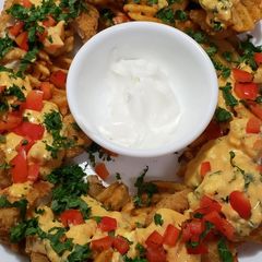 A picture of Waffle Fry "nachos" (WTF is 4 dinner) Dinner.