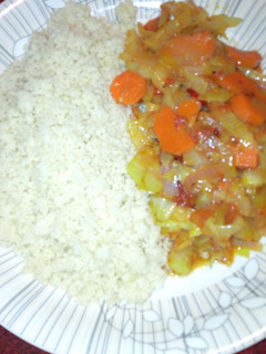 A picture of Couscous with vegetable sauce.