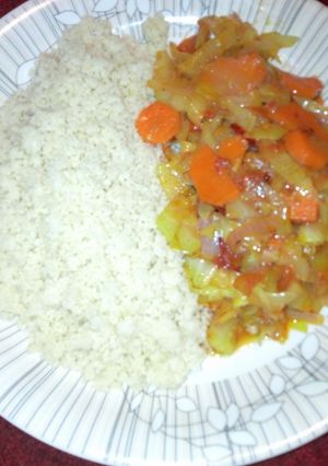 A picture of Couscous with vegetable sauce.