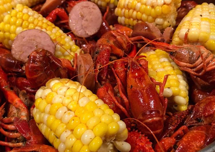 How to Prepare Award-winning Cajun Inspired Spicy Buttered Crawfish Boil with Sausage and Corn