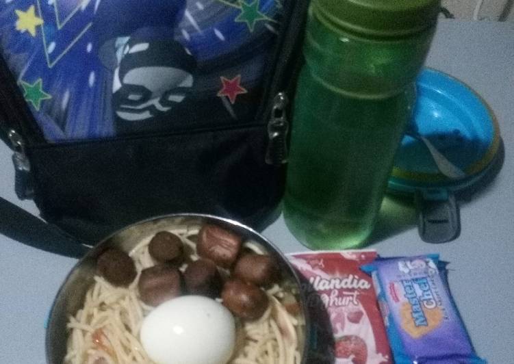 Pasta with boiled egg and fried sausage