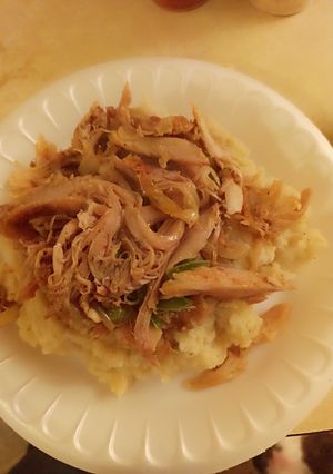 A picture of Chicken fajitas with mashed potatoes.