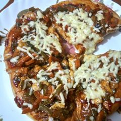 A picture of Veg pizza on tawa INDIAN STYLE.