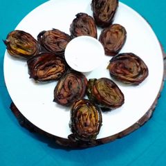 A picture of Alu vadi (colacasia leaves fritters).