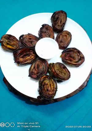 A picture of Alu vadi (colacasia leaves fritters).