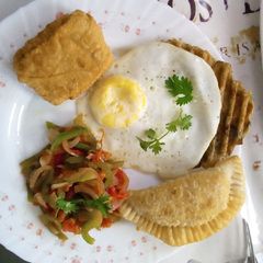 Poached eggs,samosa,hash browns and kachumbari A picture of Poached eggs,samosa,hash browns and kachumbari.