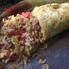 A picture of Fried Rice stuffed Omelette.