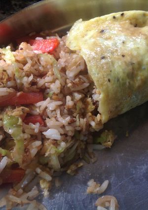 A picture of Fried Rice stuffed Omelette.