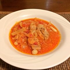 A picture of Chicken Tomato stew European style.