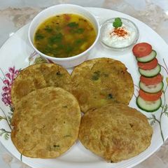 A picture of Wheat flour Puri and potato sabji.