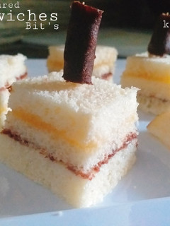 A picture of Three coloured sandwiches Bit's.