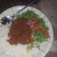 A picture of Coconut rice with stew &salad.
