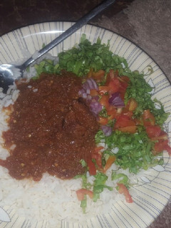 A picture of Coconut rice with stew &salad.