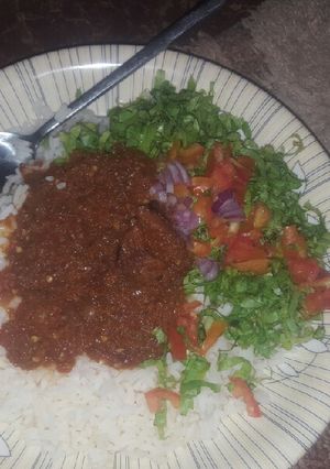A picture of Coconut rice with stew &salad.