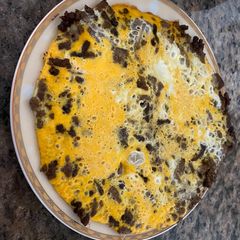 A picture of Mince with eggs and you can put potato as well.