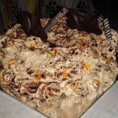 A picture of Eggless chocolate flower birthday cake.