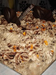 A picture of Eggless chocolate flower birthday cake.