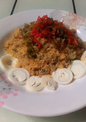 A picture of Steamed Rice Grits (Dambun Shinkafa) with Pepper and Onion Sauce.