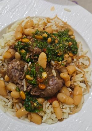 صورة لوصفة فاصولياء بيضاء صوص بندورة مع رز