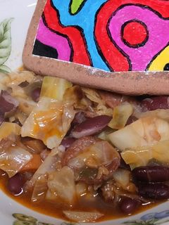Una foto de Alubias rojas con repollo salteado en olla a presión