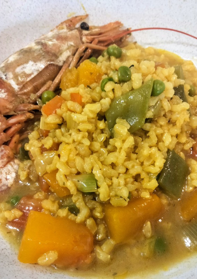 Una foto de Arroz caldoso con gambas al curry