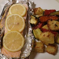 A picture of Garlic roasted veg with oven baked salmon.