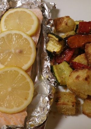 A picture of Garlic roasted veg with oven baked salmon.