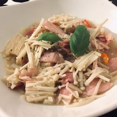 A picture of Pan fry enokitake with bacon 🥓.