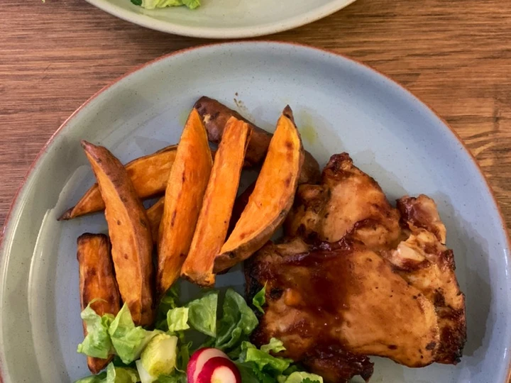 Recipe Sticky bbq chicken thighs served with sweet potato chips and a crisp lemon salad the Delicious Tasty