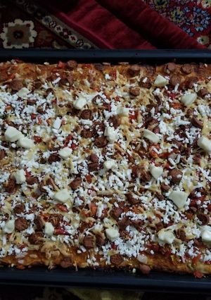 A picture of Homemade 1/2 meter pizza.