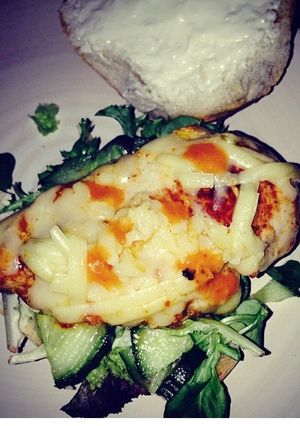 A picture of Tomato pesto with cheese & salad chicken burger.
