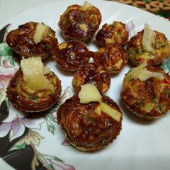 A picture of Omelete mixture baked in cases.