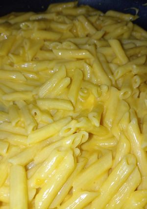 Una foto de Plumitas en salsa de queso